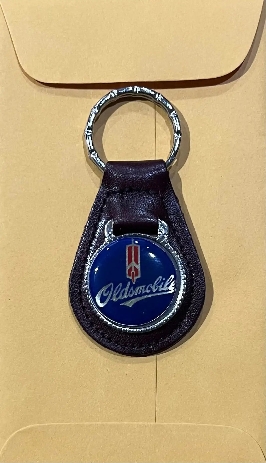 Oldsmobile Top Grain Brown Leather Vintage Key Fob NOS Accessories EXC Relic has been store safely away for decades and will be a great addition to your classic
