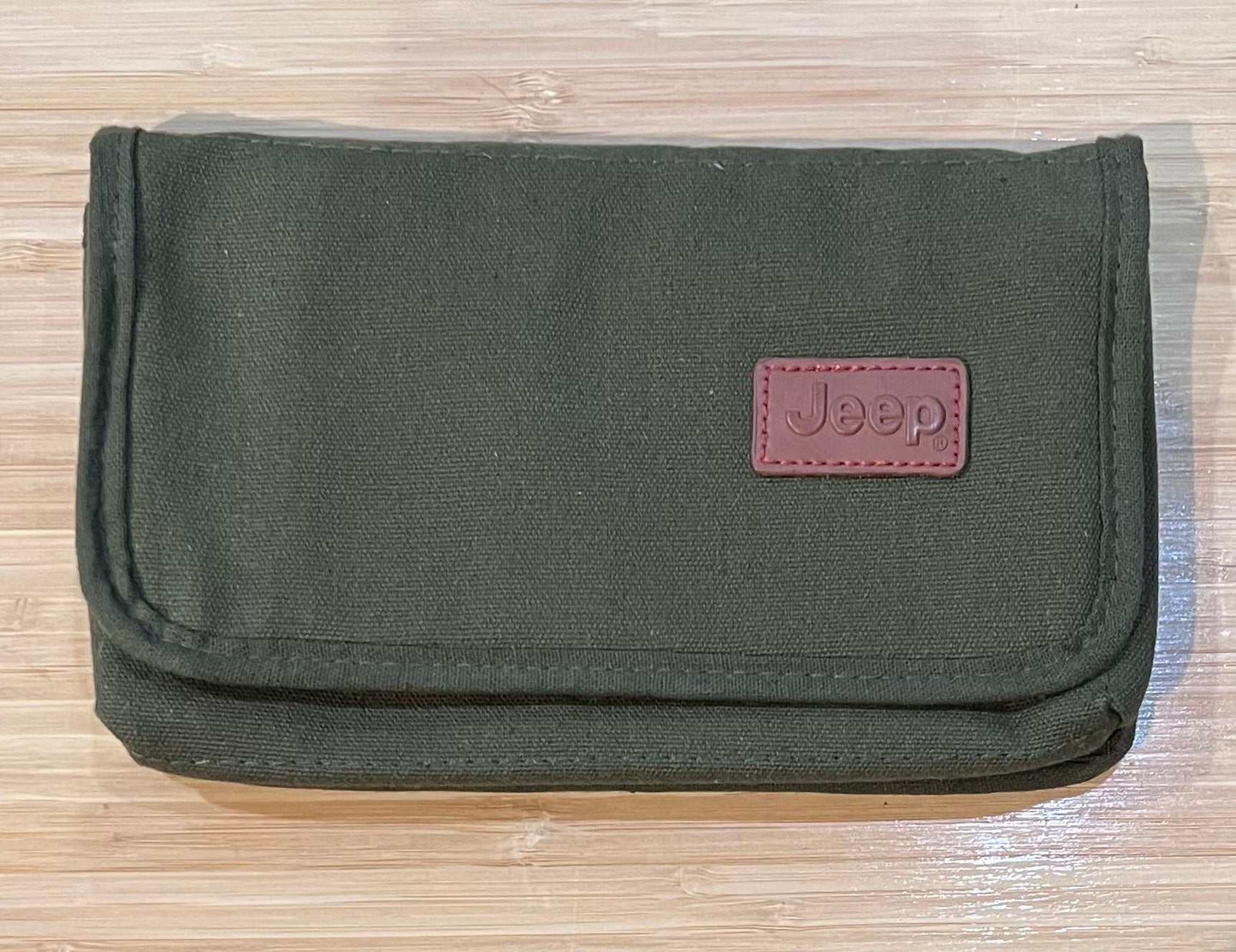 Jeep Canvas Manual and Storage Holder from 2015 Sahara Collectors N.O.S. Relic has been safely stored away for last 20 years and would make for a great replacement or gift
