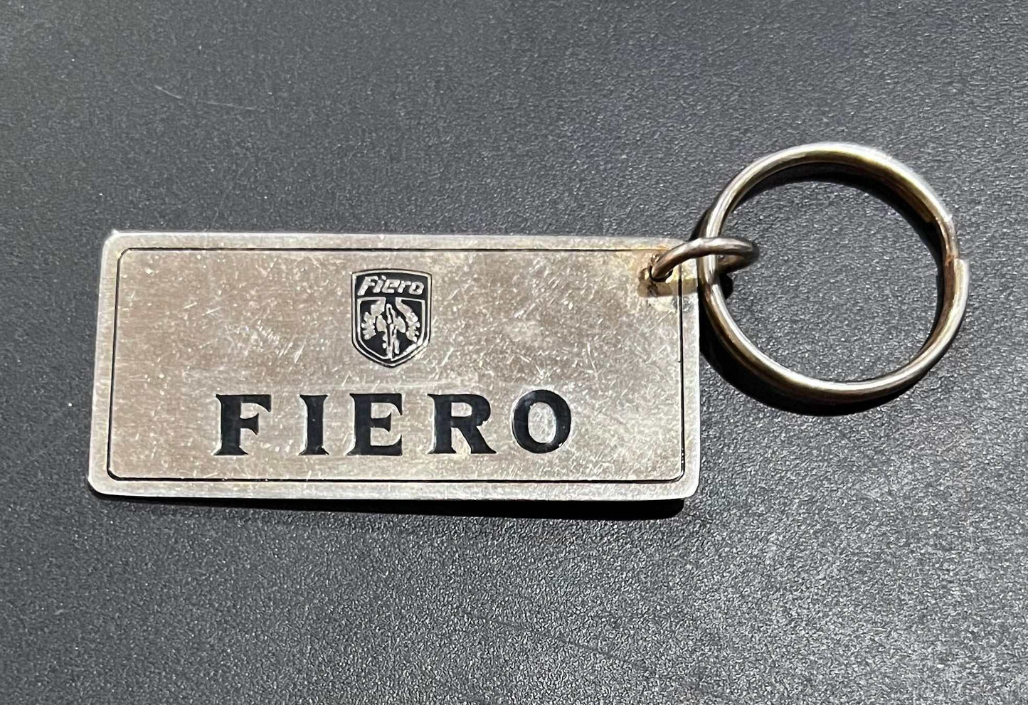 Pontiac Fiero Gold Plated Metal Keychain with Engravable Backside NOS Relic has been store safely away for decades and shows some wear but vintage from the 1980s