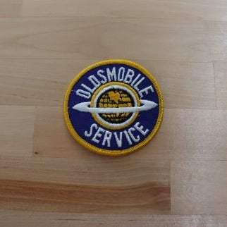 OLDSMOBILE Global SERVICE Vintage Auto PATCH NoS Mint New Old Stock OLDSMOBILE SERVICE patch with the Global Saturn ring. We have a matching other Olds designs