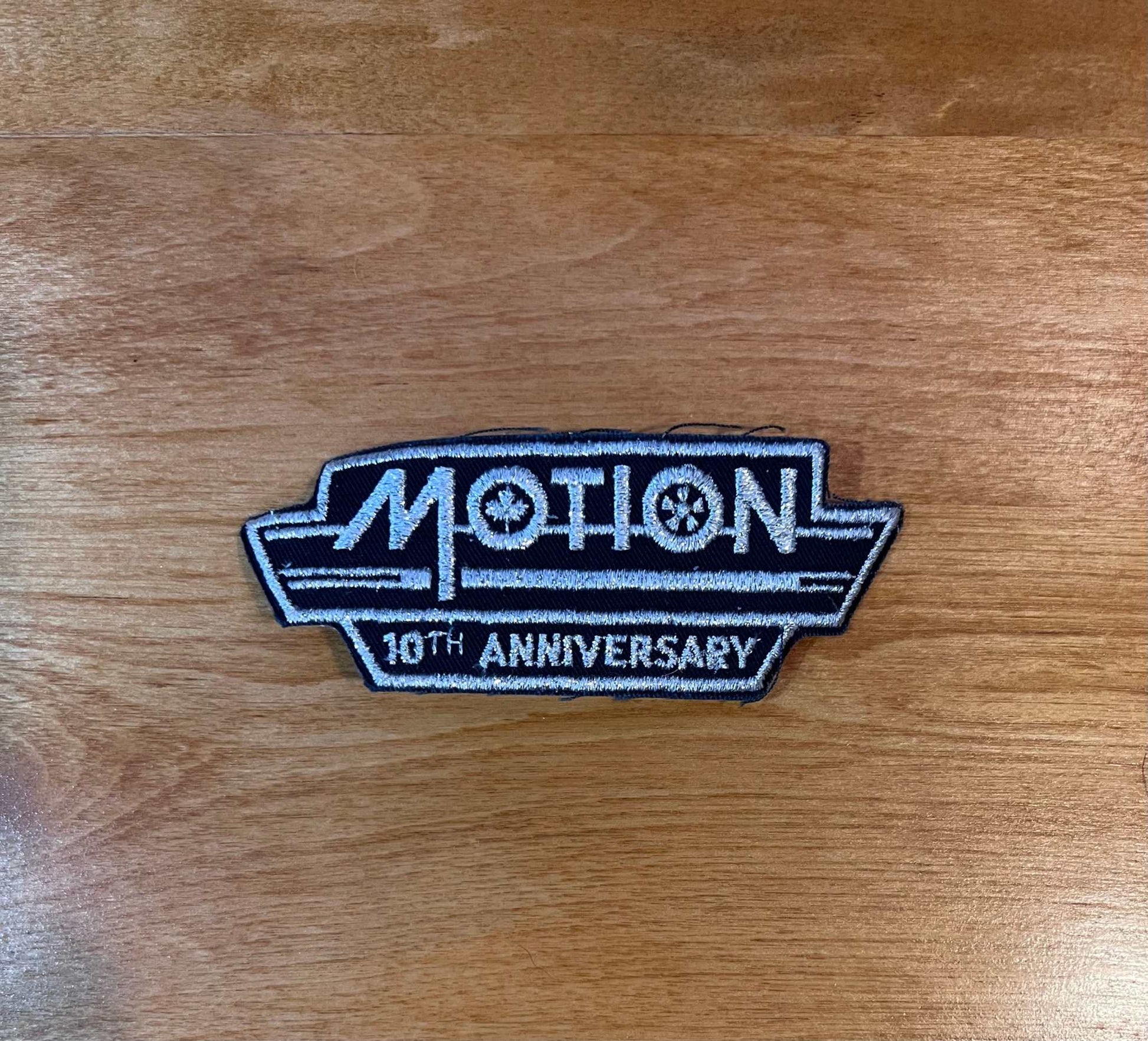 Motion Canada 10th Anniversary Glitter Vintage Patch Parts NOS Condition Relic has been safely stored away for decades and measures approx 1.75 x 4 in sponsorship