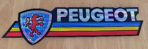 PEUGEOT DECAL Vintage 1970s Iridescent Logo Bumper Sticker N.O.S. Mint adhesive decal. This relic measures approx 2.75 inches in width by 10 inches in length.