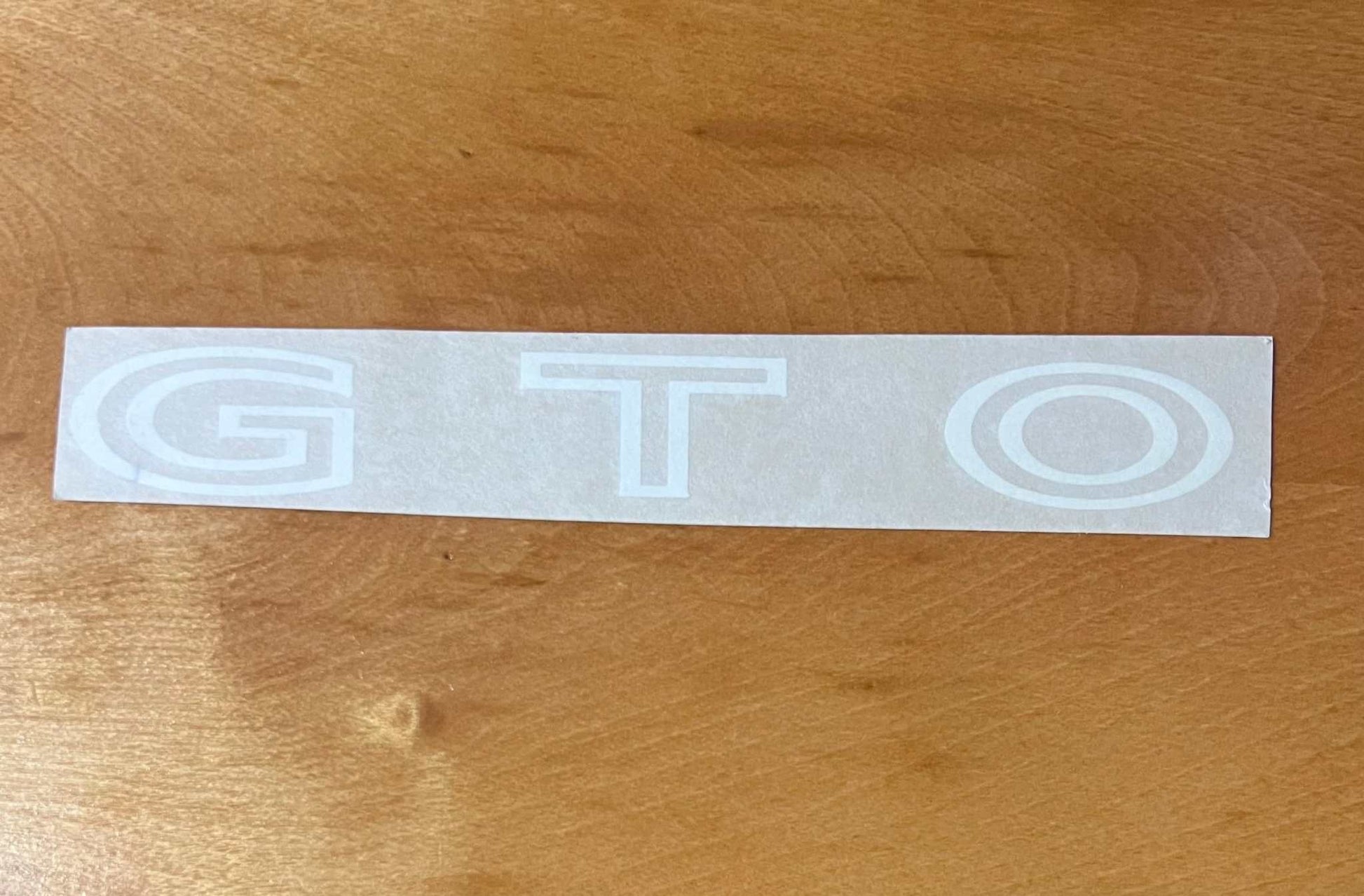 Pontiac 1970-73 GTO White Deck Lid Decal EXC Cond Restoration Project. Relic has been stored safely away for decades and measures approx 1 in wide x 8 in length