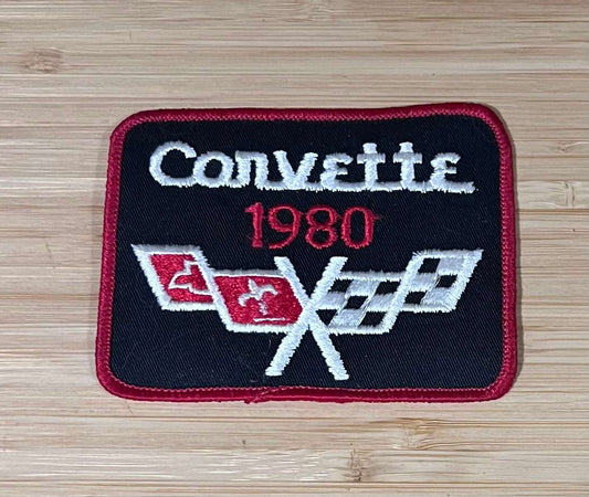 Corvette 1980 Cross Flags Logo Black Vintage Patch NOS Excellent Condition Relic has been safely stored away for decades and measures approximately 4 x 3 inches