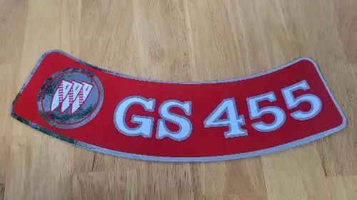 Buick GS 455 Decal Red Metallic Air Cleaner 1970-1974 Auto N.O.S. Item. This relic has been stored for decades and measures 3 inches in width by 11 inches in length.