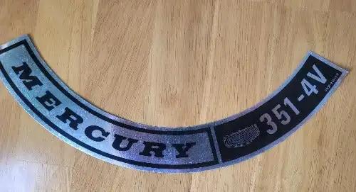 Mercury 351-4V Decal Four Barrel Black and Silver Metallic Top Air Cleaner. This relic has been stored for decades and measures 3 in in width by 7 in in length.