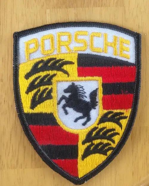 Porsche Shield Patch Large Black Shield Vintage Auto Patch N.O.S. Item. This relic has been stored for decades and measures 3.75 inch in width by 3 inches in length.