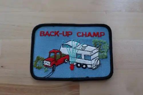 BACK UP CHAMP Camper RV Patch Vintage Unique Camping Nature Mint EXC is comical with the scene of a truck backing up hitting trees and a hydrant Simply just good fun