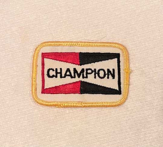 CHAMPION Spark Plugs patch. Item measures approximately 3 x 2 inches, detailed stitching and in excellent condition. Stored away with care for many decades. N.O.S.
