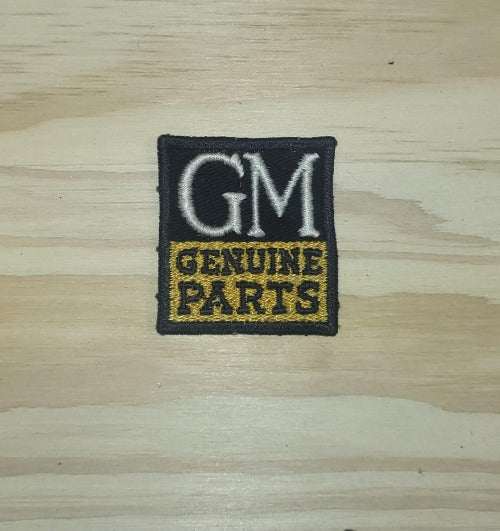 GM Genuine Parts Patch a General Motors Item. This relic has been stored for decades and is in great shape. It measures 2 in in width by 1.75 in in length. Great Add