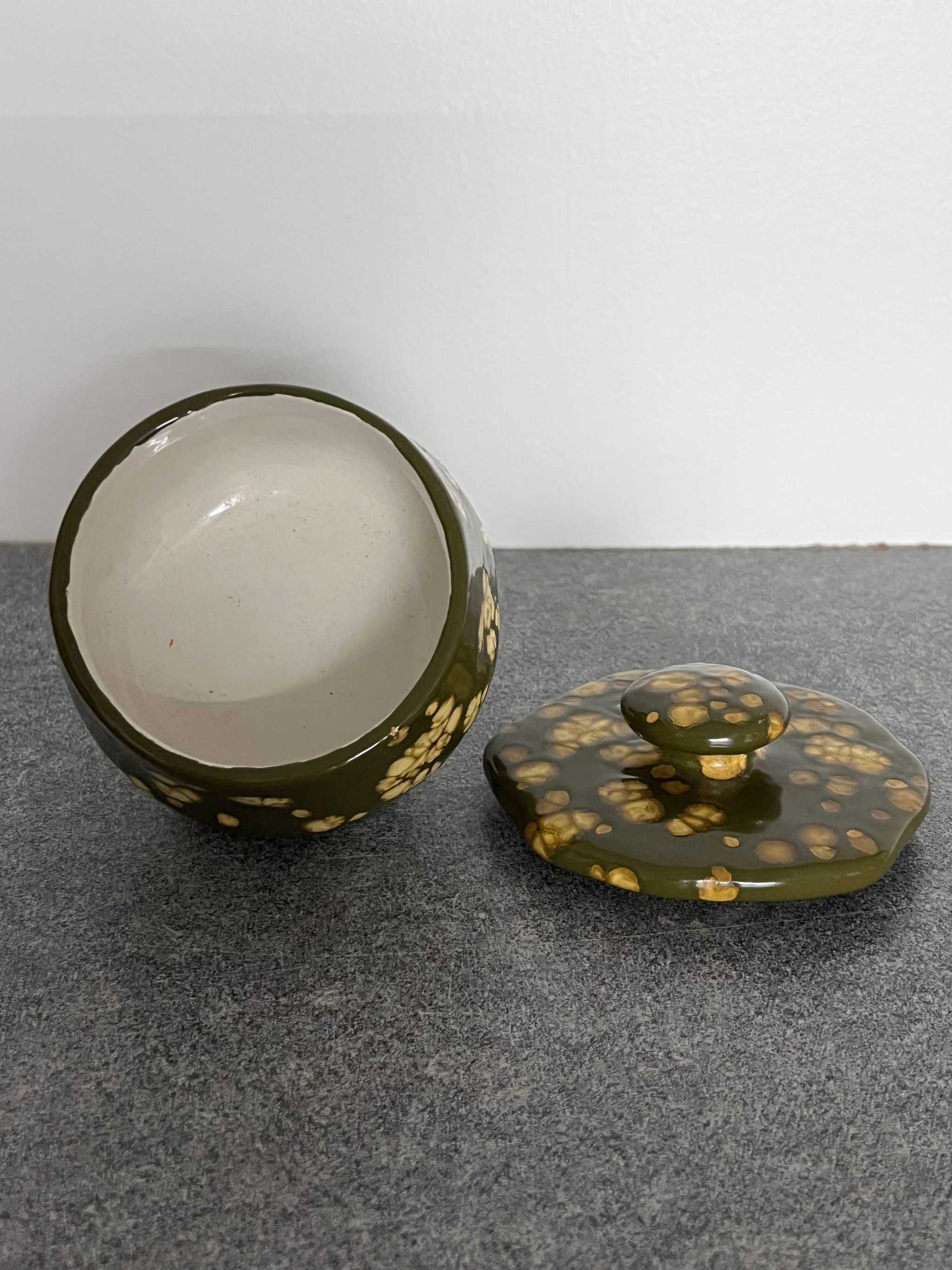 Adorable Ceramic Pottery Dish with Lid, button top handle and three round legs.  This is a great unique one of a kind item in excellent vintage condition.