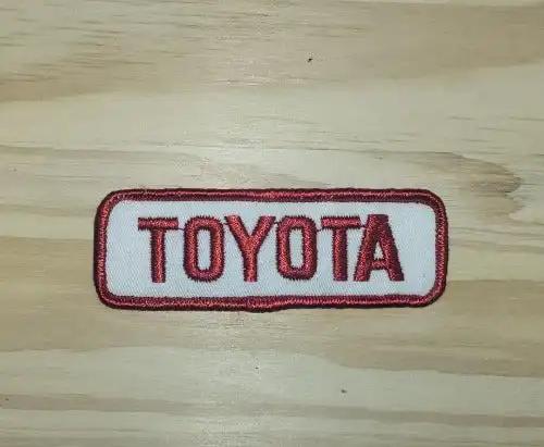 Toyota Patch Red Block Lettering Auto VINTAGE Traditional N.O.S. Racing. This relic has been stored for decades and measures 1.25 inches wide and 4 inches in length.