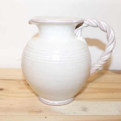Gilde Handwerk Pottery Pitcher, vintage stoneware item.  Great detail, twisted handle, and cream color